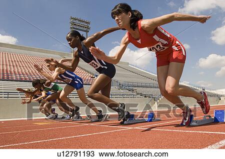 Group of female track athletes sprinting View Large Photo Image Stock Image - Group of female track athletes sprinting. Fotosearch