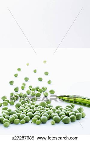 Group of loose peas with empty pea pod, close-up View Large Photo Image Stock Photography - Group of loose peas with empty pea pod, close-up. Fotosearch