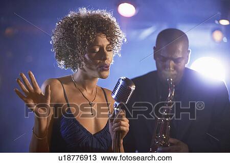 Stock Image - Jazz Singer and Saxophonist Performing. Fotosearch