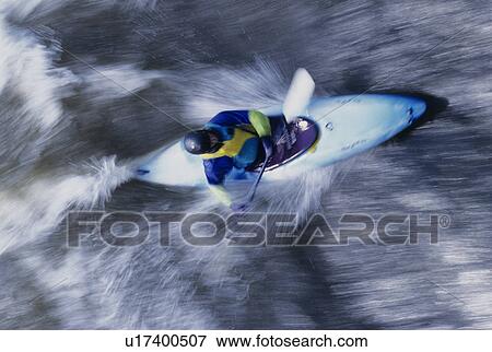 Kayaker paddling through Rapids, overhead view View Large Photo Image Stock Photo - Kayaker paddling through Rapids, overhead view. Fotosearch