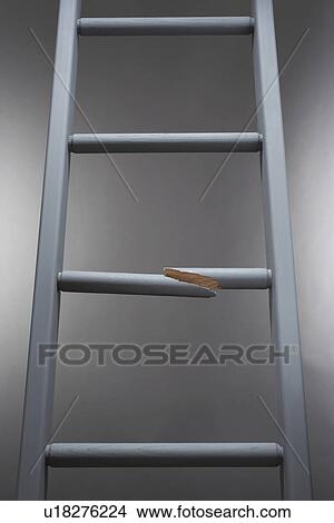 Picture - Ladder with one step broken. Fotosearch
