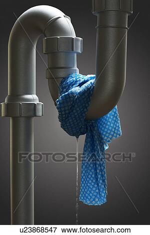 Stock Photo - Leaking pipe with towel. Fotosearch