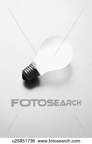 Light bulb on white background in studio View Large Photo Image Stock Photograph - Light bulb on white background in studio. Fotosearch