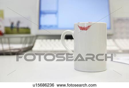 Lipstick Print on Coffee mug by computer on desk, close up View Large Photo Image Stock Photograph - Lipstick Print on Coffee mug by computer on desk, close up. Fotosearch