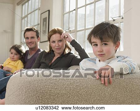 Little Boy on Sofa With Family View Large Photo Image Stock Image - Little Boy on Sofa With Family. Fotosearch