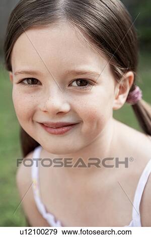 Little Girl sitting in backyard, portrait, close up View Large Photo Image Stock Photo - Little Girl sitting in backyard, portrait, close up. Fotosearch