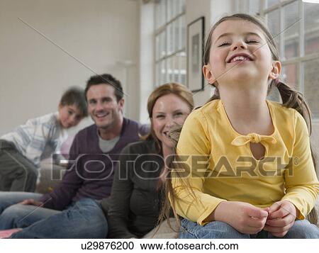 Little Girl Smiling With Family View Large Photo Image Stock Image - Little Girl Smiling With Family. Fotosearch