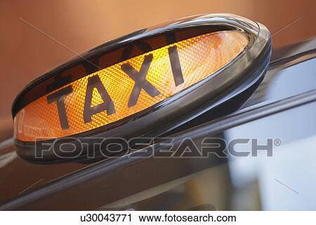 Stock Image - London taxi sign, close up. Fotosearch