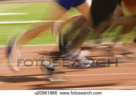 Low section of runners running on a track View Large Photo Image Stock Photograph - Low section of runners running on a track. Fotosearch
