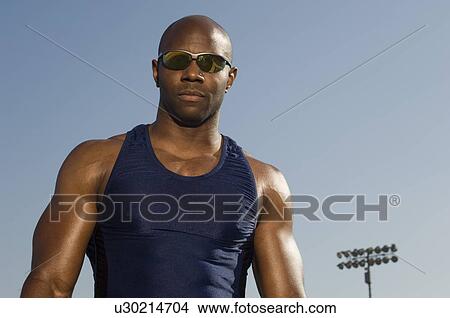 Male athlete at stadium View Large Photo Image Picture - Male athlete at stadium. Fotosearch