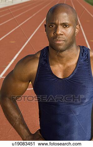 Male athlete at stadium View Large Photo Image Stock Image - Male athlete at stadium. Fotosearch