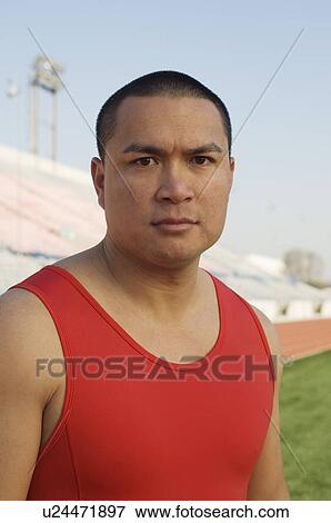Stock Photo - Male athlete at stadium. Fotosearch