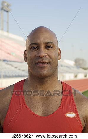 Stock Photo - Male athlete at stadium. Fotosearch