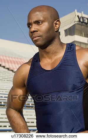 Male athlete at stadium View Large Photo Image Stock Photograph - Male athlete at stadium. Fotosearch