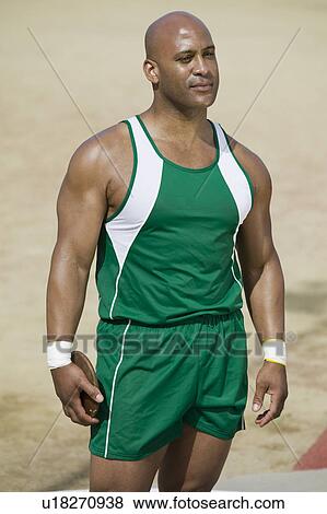Stock Photo - Male athlete holding discus. Fotosearch