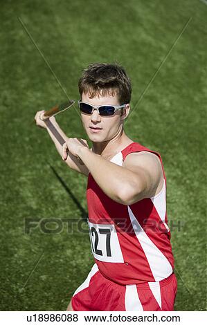 Male athlete throwing javelin View Large Photo Image Stock Photo - Male athlete throwing javelin. Fotosearch