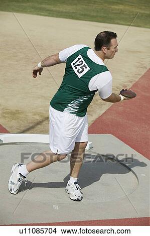 Male athlete training in circle View Large Photo Image Picture - Male athlete training in circle. Fotosearch