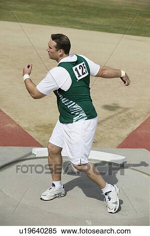 Stock Photography - Male athlete training in circle. Fotosearch
