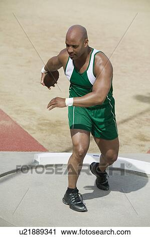 Male athlete training with discus in circle View Large Photo Image Stock Image - Male athlete training with discus in circle. Fotosearch
