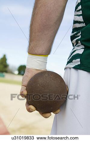 Male shot putter holding shot, close-up view View Large Photo Image Stock Image - Male shot putter holding shot, close-up view. Fotosearch