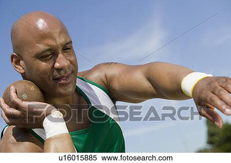 Male shot putter holding shot View Large Photo Image Stock Photography - Male shot putter holding shot. Fotosearch