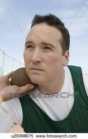 Male shot putter holding shot View Large Photo Image Stock Photography - Male shot putter holding shot. Fotosearch