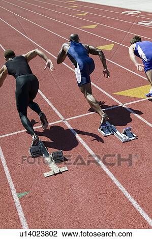 Male sprinters leaving starting blocks View Large Photo Image Stock Image - Male sprinters leaving starting blocks. Fotosearch