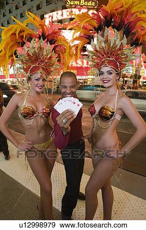 Stock Photo - Man and female dancers having fun. Fotosearch