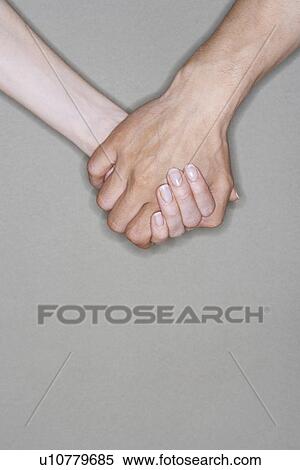 Man and woman holding hands, close-up on hands View Large Photo Image Stock Photography - Man and woman holding hands, close-up on hands. Fotosearch