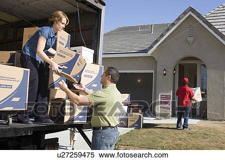 Man and woman unloading truck of cardboard boxes View Large Photo Image Stock Photography - Man and woman unloading truck of cardboard boxes. Fotosearch