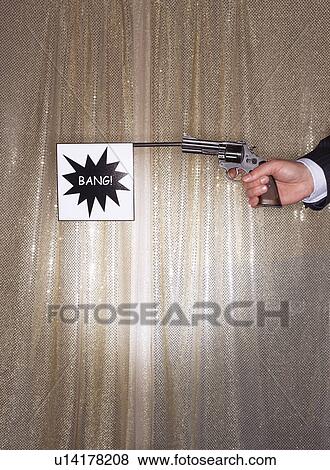 Man firing pistol with bang flag, close-up of hand View Large Photo Image Stock Photo - Man firing pistol with bang flag, close-up of hand. Fotosearch