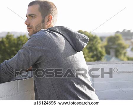 Man looking over balcony, half length View Large Photo Image Stock Photograph - Man looking over balcony, half length. Fotosearch