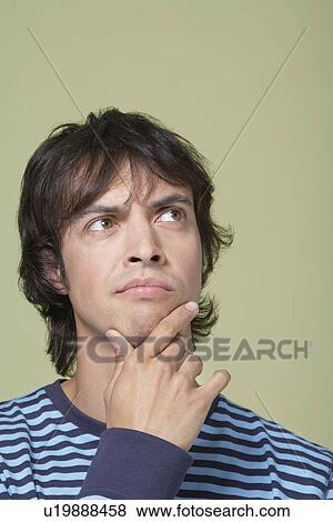 Man looking up, thinking, close-up View Large Photo Image Stock Photo - Man looking up, thinking, close-up. Fotosearch
