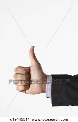 Man making thumbs-up sign against white background, close up of hand View Large Photo Image Picture - Man making thumbs-up sign against white background, close up of hand. Fotosearch