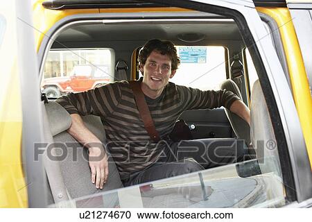 Stock Image - Man on Back Seat of Car. Fotosearch