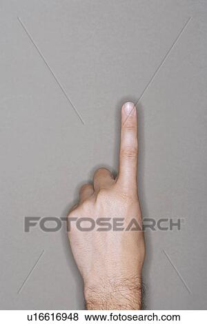 Man pointing upwards, close-up on hand View Large Photo Image Stock Photo - Man pointing upwards, close-up on hand. Fotosearch