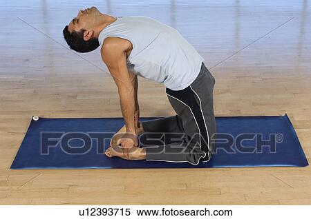 Stock Photography - Man Practicing Yoga. Fotosearch