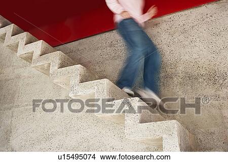 Man running down stairs, motion blur, low section View Large Photo Image Picture - Man running down stairs, motion blur, low section. Fotosearch