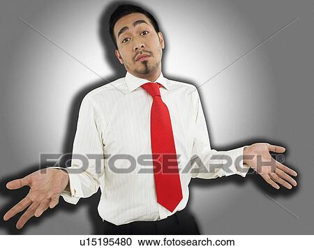 Man shrugging in front of spotlight effect, half-length View Large Photo Image Stock Image - Man shrugging in front of spotlight effect, half-length. Fotosearch