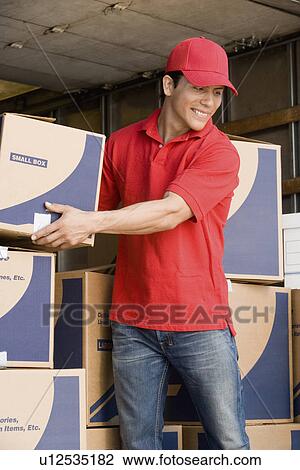 Man unloading a removal van View Large Photo Image Stock Image - Man unloading a removal van. Fotosearch