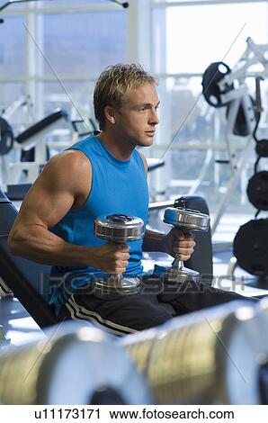Man Weightlifting With Dumbbells View Large Photo Image Stock Image - Man Weightlifting With Dumbbells. Fotosearch