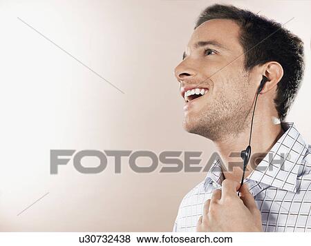 Man with earpiece, head and shoulders View Large Photo Image Stock Photo - Man with earpiece, head and shoulders. Fotosearch