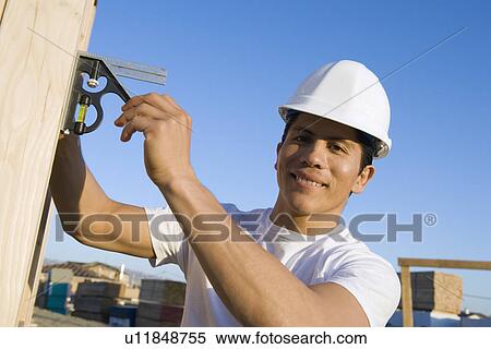 Stock Photography - Man working in construction site. Fotosearch