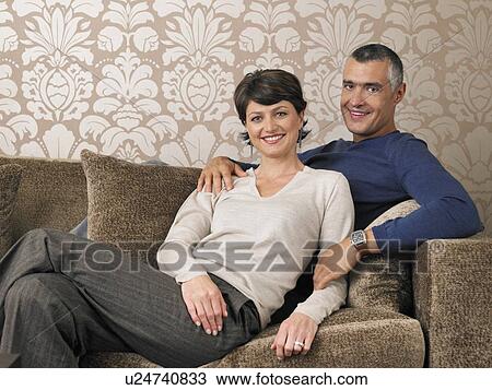 Married Couple Relaxing on Sofa View Large Photo Image Stock Image - Married Couple Relaxing on Sofa. Fotosearch