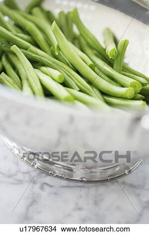 Picture - Metal bowl of green beans. Fotosearch