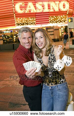 Mid-adult couple in front of casino building, portrait View Large Photo Image Stock Image - Mid-adult couple in front of casino building, portrait. Fotosearch