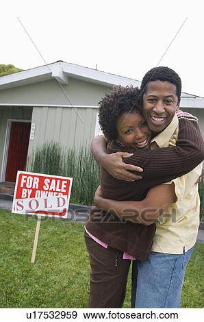 Mid-adult couple in front of new house, portrait View Large Photo Image Stock Photo - Mid-adult couple in front of new house, portrait. Fotosearch