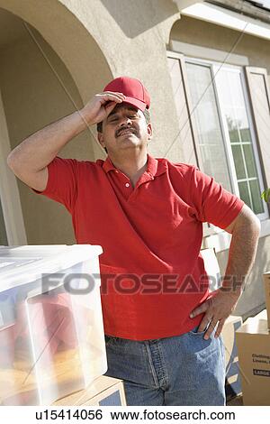 Mid-adult man putting on baseball cap, outdoors View Large Photo Image Stock Photograph - Mid-adult man putting on baseball cap, outdoors. Fotosearch