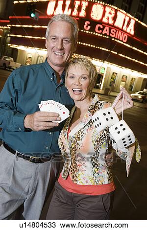 Middle-aged couple in front of casino building, portrait View Large Photo Image Stock Image - Middle-aged couple in front of casino building, portrait. Fotosearch