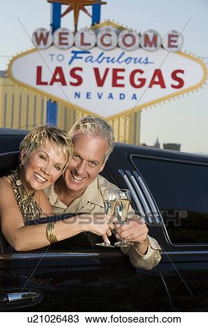 Middle-aged couple in limousine in front of Welcome to Las Vegas sign, portrait View Large Photo Image Stock Image - Middle-aged couple in limousine in front of Welcome to Las Vegas sign, portrait. Fotosearch